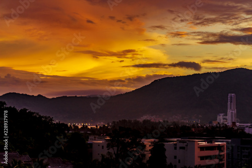 A dramatic sunrise over the city of Patong from the southern hillside.