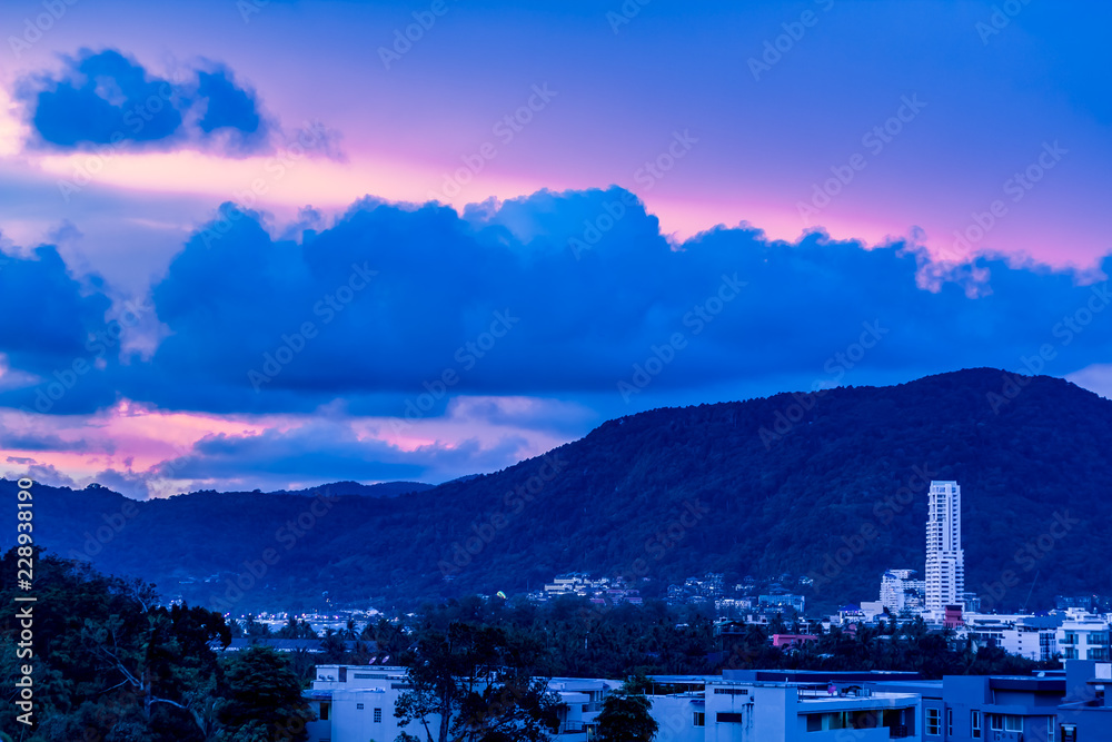 A dramatic sunrise over the city of Patong from the southern hillside.