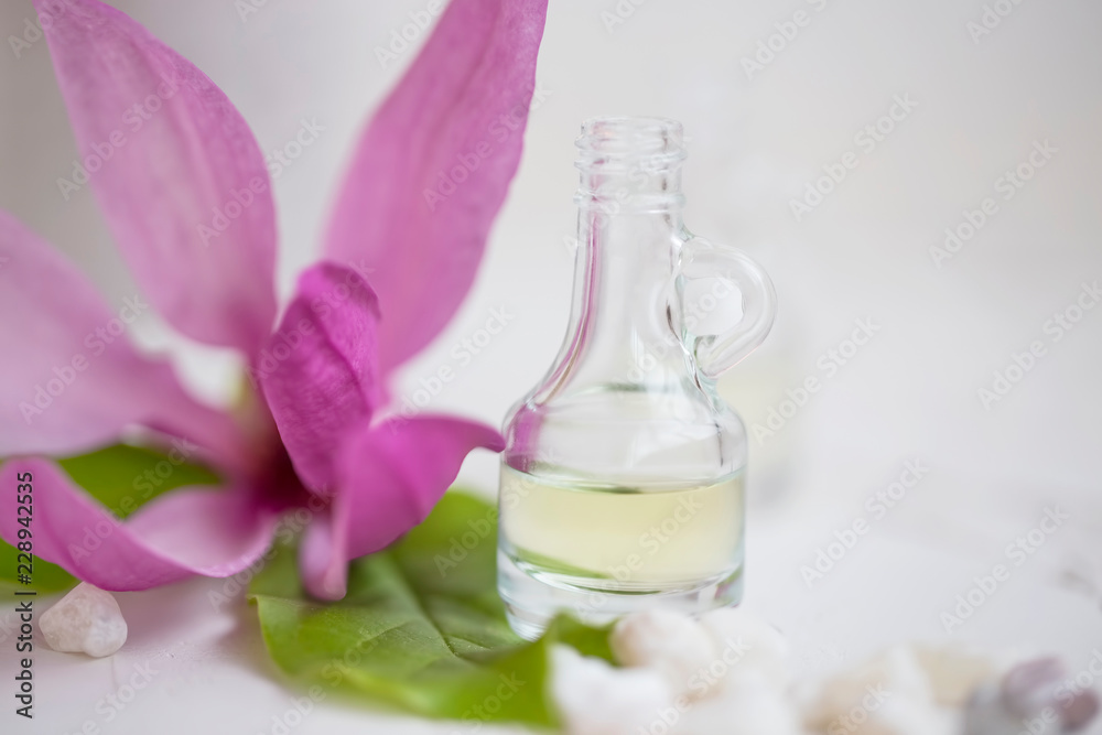 Floral oil bottle, spa still life closeup