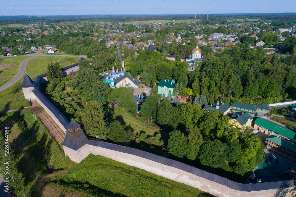 Holy Dormition Pskovo-Pechersky Monastery in the summer landscape (aerial photography). Pechory, Russia