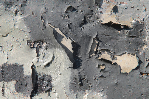 Background of the vertical surface of the old wall treated with gray paint .. Texture, cropped shot, close-up, blurred, only, vertical, cracks