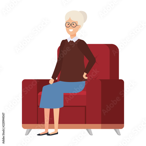 grandmother sitting in sofa with december clothes