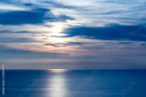 Sunset from Karon Viewpoint  Phuket Thailand with a very blue sky.