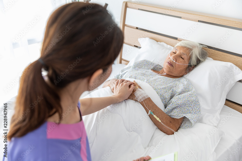 Obraz premium nursing care for elderly female patient