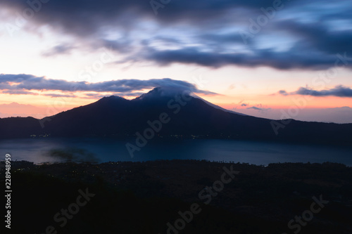 Sunrise view from Gunung Batur volcano in Bali with visible Mount Agung volcano © Rytis