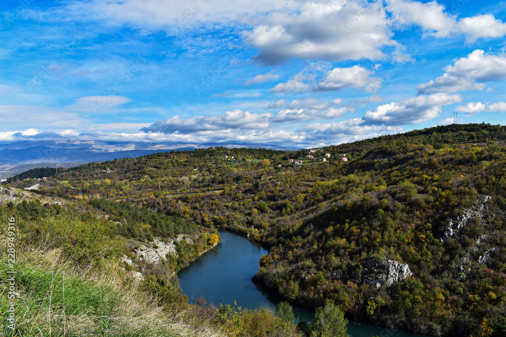 River canyon under the white clouds and beautiful sky/ river Cetina-Croatia River canyon under the white clouds and beautiful sky/ river Cetina-Croatia