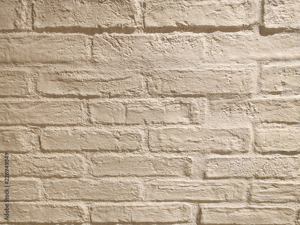 beige brick wall in the evening light beige brick wall in the evening light