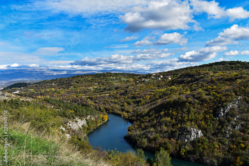 River canyon under the white clouds and beautiful sky/ river Cetina-Croatia © Sanja