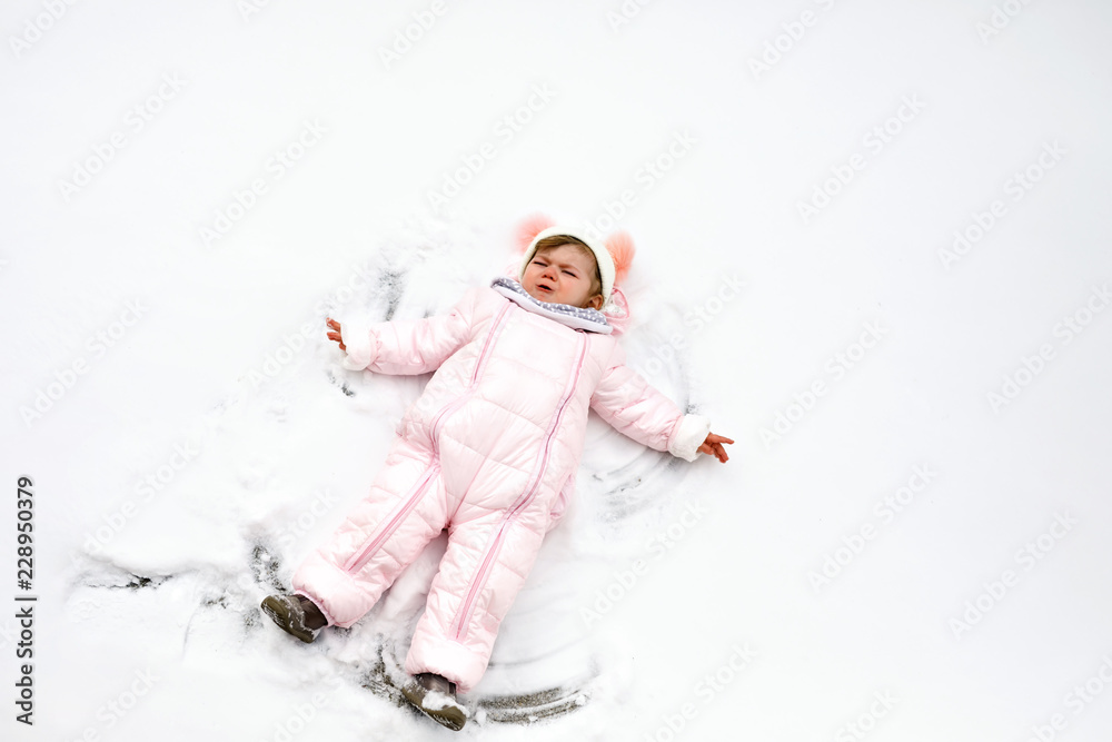 baby girl in colorful winter clothes 