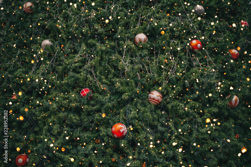 Vintage Christmas tree with ball decoration and sparkle light filter effect. Christmas and New Year holiday background. vintage color tone.