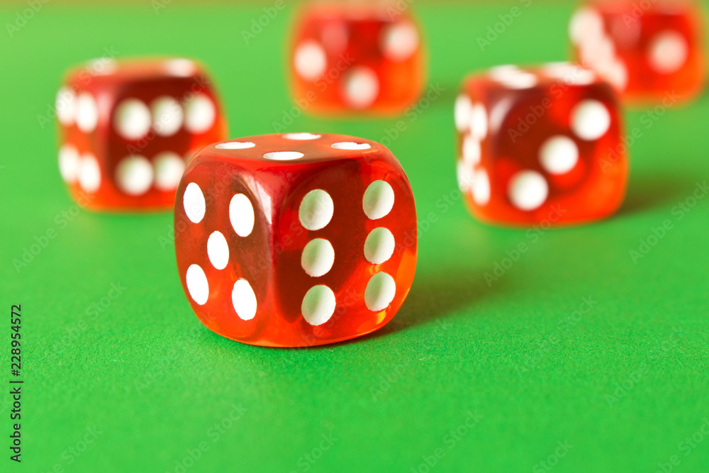 Dice on a green background . Game concept. Games of chance Dice on a green background . Game concept. Games of chance