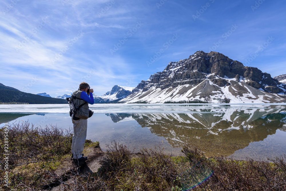 A Man Photographing Bow Lake, Alberta, Canada