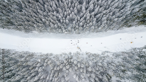 Aerial view of the ski slope in the mountains where skiers ride photo