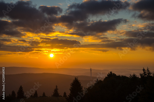 Germany, Black forest sunrise on mountain top with fog in autumn photo