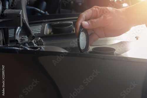 Car repair service, Hand man checking water level