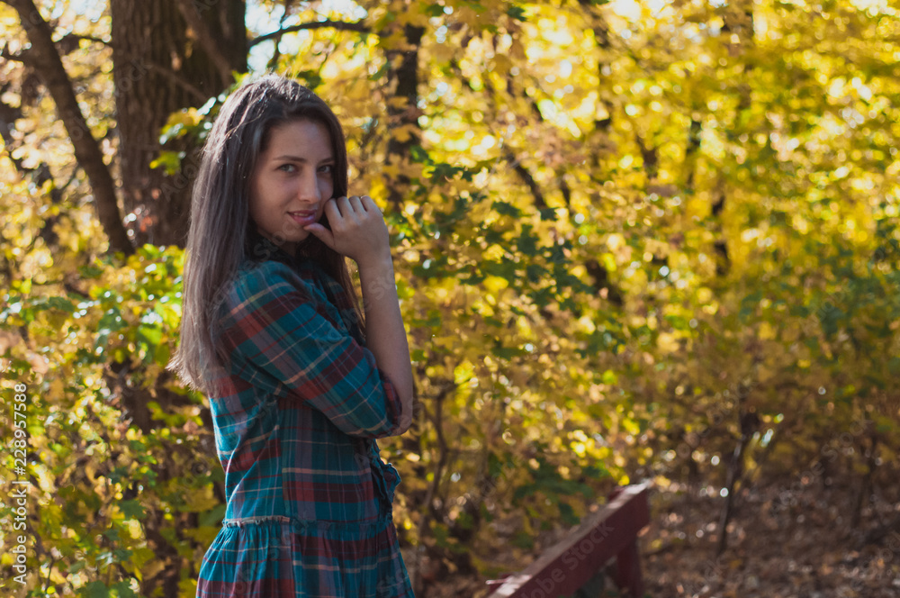 Portrait of Young Fashion Woman Outdoor on Autumn Background