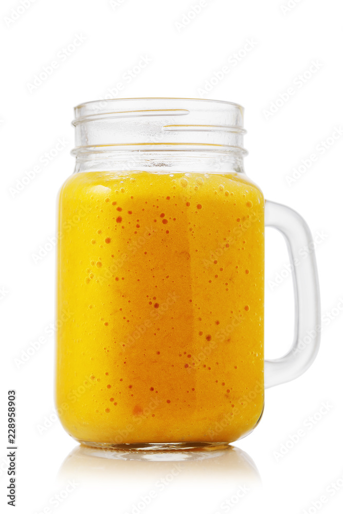 Smoothies made from ripe orange in glass jar isolated on white background Smoothies made from ripe orange in glass jar isolated on white background