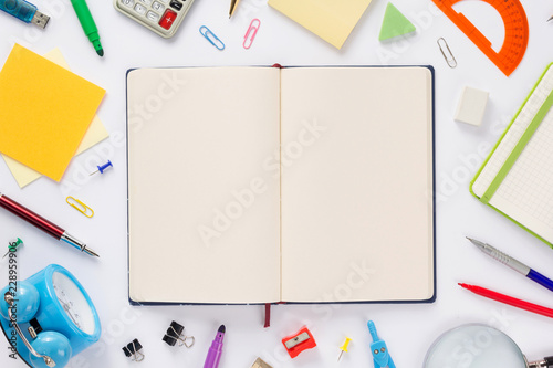 school accessories and open notebook