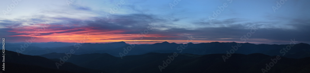 High resolution colorful sunset panorama, silhouette of the Chornohora mountain range of the Carpathians, Ukraine