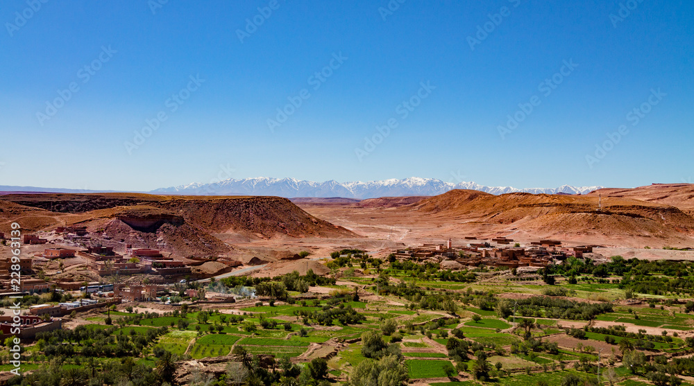 Traditional Berber city against the snowy Atlas Mountains. Africa Morocco Ait Ben Haddou