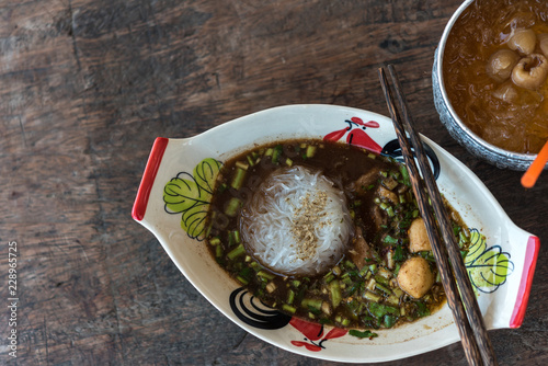 Braised beef clear noodle with meat ball soup stew photo