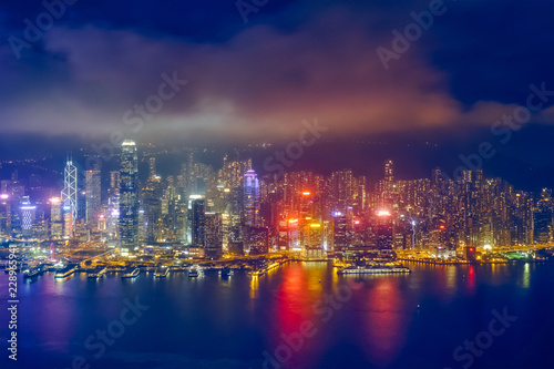Fototapeta Naklejka Na Ścianę i Meble -  Aerial view of illuminated Hong Kong skyline. Hong Kong, China