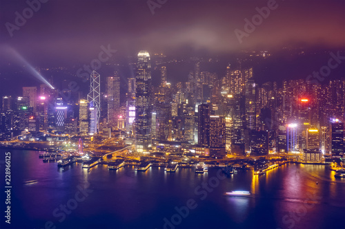 Aerial view of illuminated Hong Kong skyline. Hong Kong, China