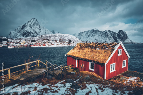 Traditional red rorbu house in Reine village on Lofoten Islands,