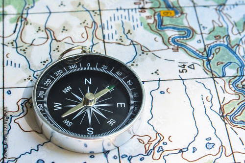 Compass and map. © sergunt