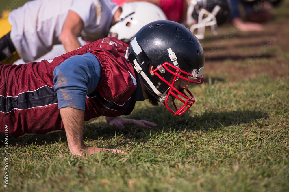 american football team doing push ups american football team doing push ups