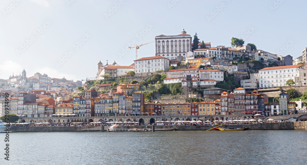 Panoramic view of the Ribera, Porto, Portugal. Colorful houses on the embankment of the river Douro.
