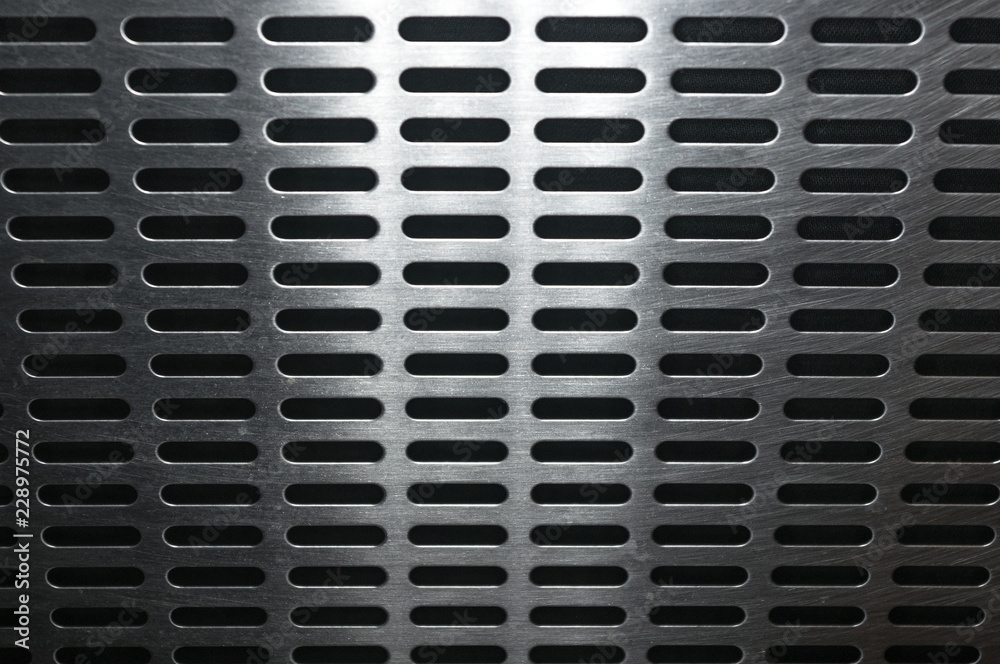 stainless steel grating with oblong holes, close-up stainless steel grating with oblong holes, close-up