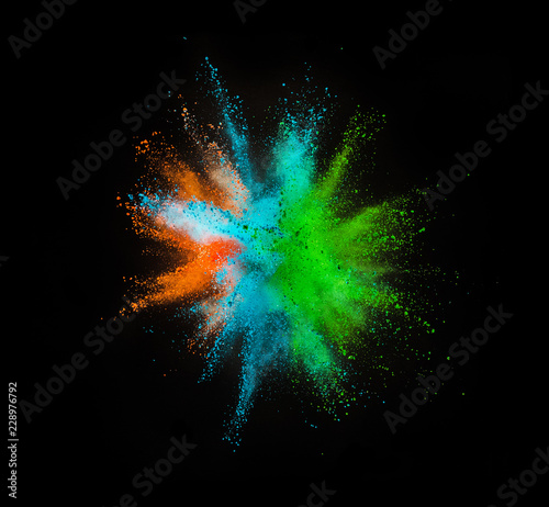 Colored powder explosion on black background © Jag_cz