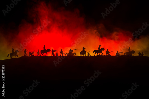 American Civil War Concept. Military silhouettes fighting scene on war fog sky background. Attack scene.