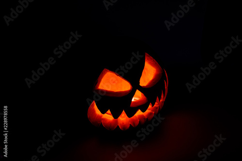 Spooky halloween pumpkin on a black background