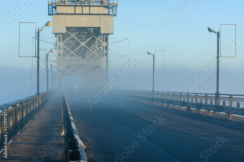 Foggy morning on a bridge in Kremenchug, Ukraine photo