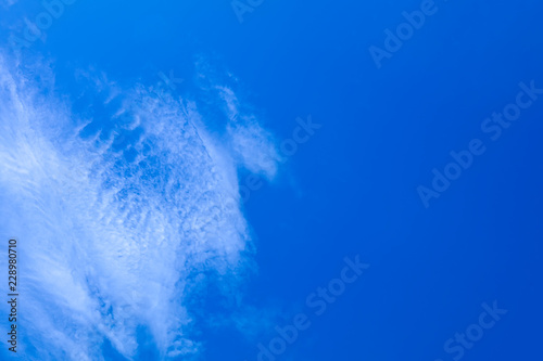 Blue sky and white clouds abstract texture blurred background.