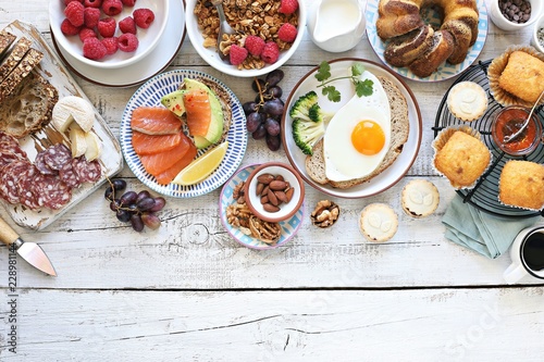 Brunch. Family breakfast or brunch set served on rustic wooden table. Overhead view, copy space