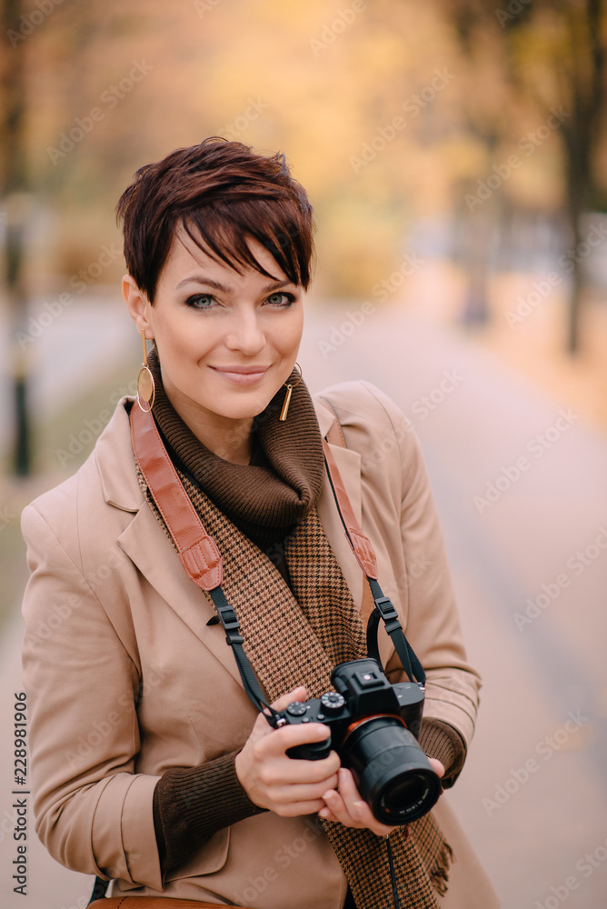 portrait female photographer on background of autumn city portrait female photographer on background of autumn city