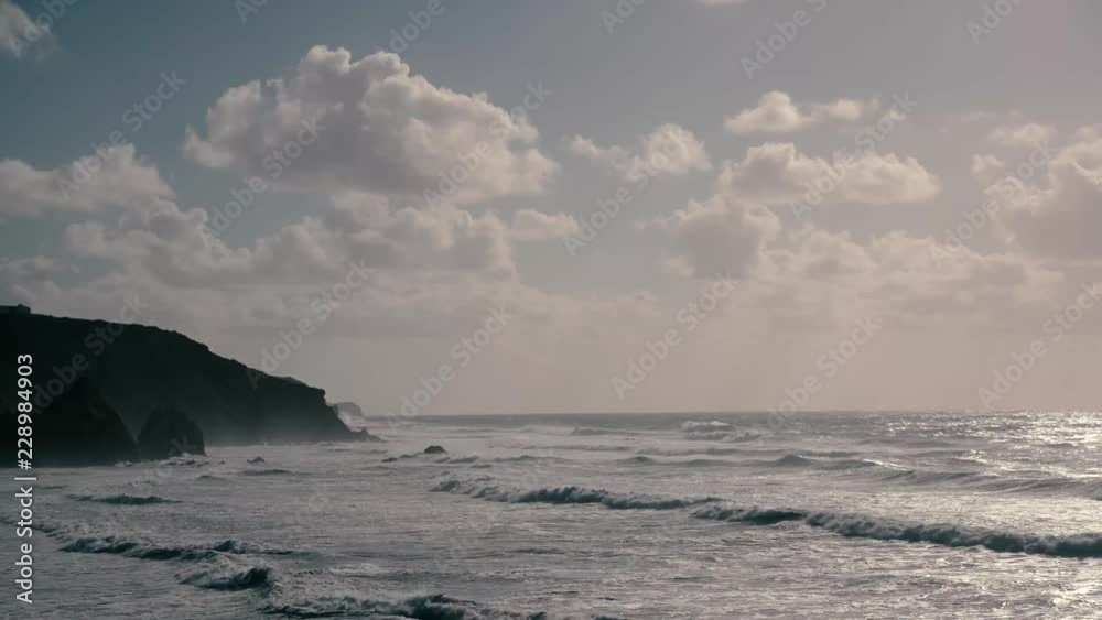 waves roll to the coast of Carrapateira, Portugal, Algarve in the evening sun, light waves roll to the coast of Carrapateira, Portugal, Algarve in the evening sun, light