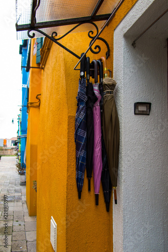 Traditional colourful houses of Burano island, yellow and pink walls © Irina Lav