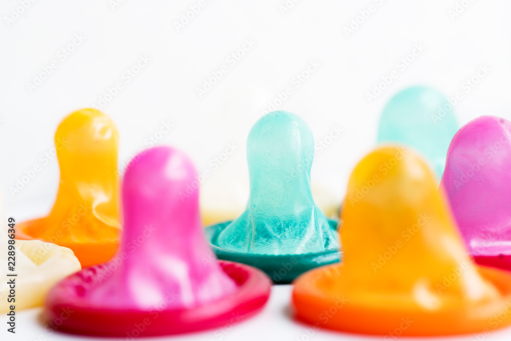 Condoms colored on the table Condoms colored on the table