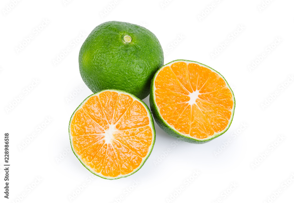 Two halves and whole ripe green tangerine on white background Two halves and whole ripe green tangerine on white background