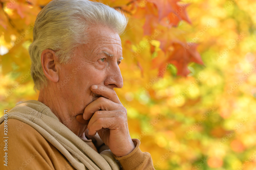 Portrait of a sad senior man outdoors Portrait of a sad senior man outdoors