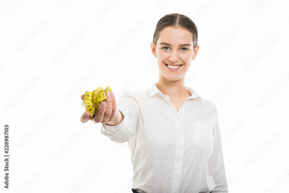 Young pretty business woman handing yellow measuring tape Young pretty business woman handing yellow measuring tape