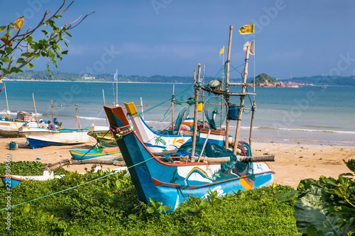 Fishing boats on Weligama beach, Sri Lanaka. photo