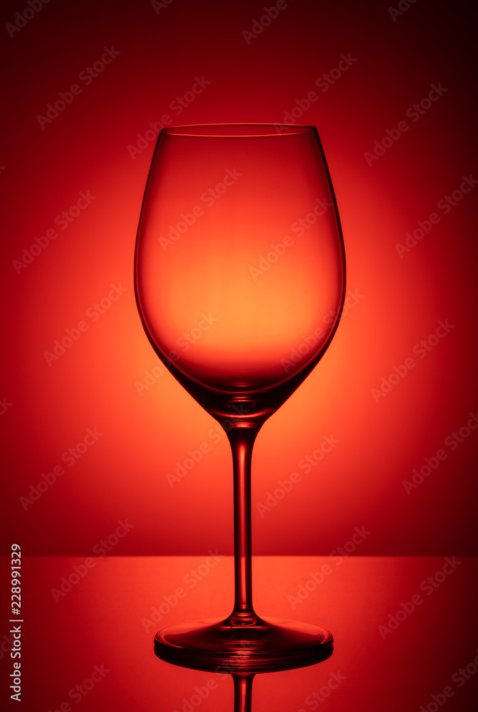wine glass on red background