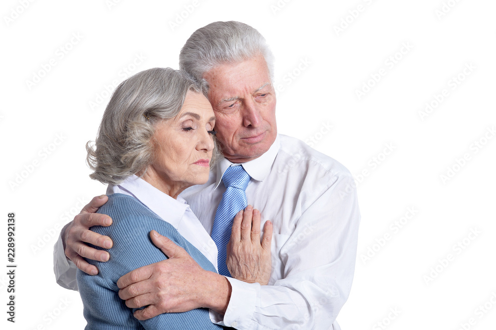 Portrait of senior couple hugging on white background Portrait of senior couple hugging on white background