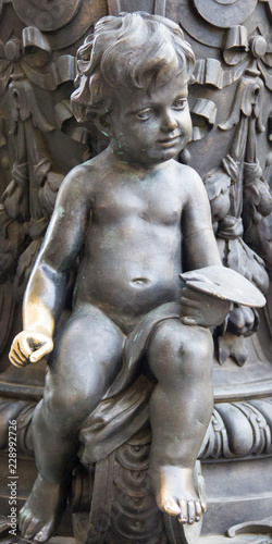 beautiful bronze angel sitting