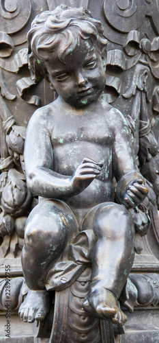beautiful bronze angel sitting